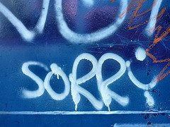 Graffito saying "sorry" for not being able to access our copywriting info